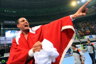 afp : Tunisia's Wissem Hamam celebrates after winning the 19th African Nations Handball Championship in Cairo on February 20, 2010. Tunisia beat Egypt 24-21 in the final