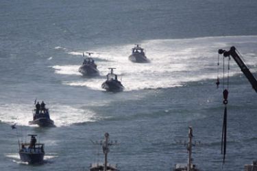 Israeli naval vessels approach the port of Ashdod May 31, 2010. Israeli marines stormed a Turkish aid ship bound for Gaza on Monday and 10 pro-Palestinian activists were killed,