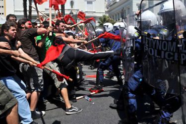 Demonstrators clash with police outside the greek Parliament during a massive Mayday demonstration to protest the austerity measures on May 1, 2010. AFP PHOTO / Louisa Gouliamaki