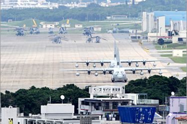 AFP (FILES) A file picture taken on April 24, 2010 shows planes and helicopters stationed at the US Marine Corps Air Station Futenma base in Ginowan, Okinawa prefecture. Japan's