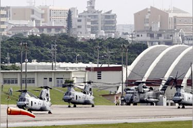 REUTERS/ Four Sea Knight transport helicopters and a Super Stallion helicopter are parked at Marine Corps Air Station Futenma in Ginowan on Okinawa May 3, 2010. Japanese Prime Minister