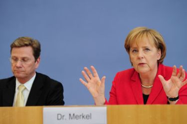 German Chancellor Angela Merkel and German Foreign Minister and vice-chancellor Guido Westerwelle address a press conference on June 7, 2010 in Berlin. Merkel reported on the results of two-day talks with her ministers on the federal budget.