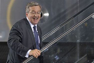 Parliament Speaker, acting president and presidential candidate Bronislaw Komorowski leaves after addressing supporters after exit polls for the early presidential elections
