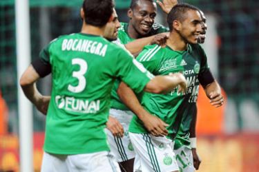 Saint-Etienne French forward Dimitri Payet (C) is congratulated by his team mates after scoring a goal during the French L1 football match Saint-Etienne vs Montpellier on September 18, 2010 at the Geoffroy-Guichard stadium in Saint-Etienne.