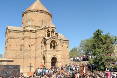Armenian Christians gather for the reopening of the Church of the Holy Cross on Akhtamar Island in Van, eastern Turkey, on September 19, 2010. Hundreds of Armenian Christians gathered at a historic church in eastern Turkey for the first mass there since World War I massacres and expulsions effaced them from the region.