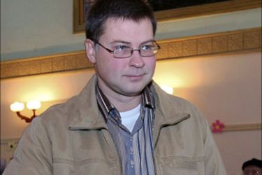 f_Prime Minister of Latvia Valdis Dombrovskis casts his ballot a polling station in Ligatne on October 2, 2010, during Latvian Parliament elections. Latvians began voting Saturday in the