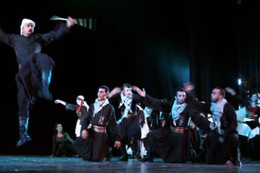Dancers of the El-Funoun Palestinian Popular Dance Troupe perform during a concert as part of the Palestinian Heritage Festival in the West Bank city of Ramallah on October 29, 2010