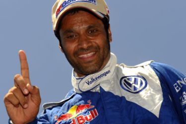 Qatar's driver Nasser Al-Attiyah celebrates in Baradero, Buenos Aires Province, on January 15, 2011 after the stage 13 Cordoba - Buenos Aires of the 2011 Dakar Rally. Qatar's Nasser al-Attiyah and German co-driver Timo Gottschalk clinched the Dakar Rally on Saturday, ending two years of heartache on the gruelling event, while defending champion Carlos Sainz was