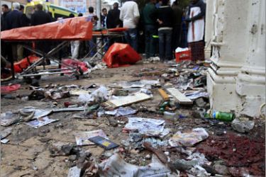 FILES) -- File picture dated January 1, 2011 shows blood stains and debris covering the sidewalk outside the Al-Qiddissine (The Saints) church following an