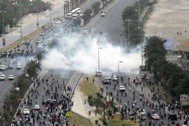 Tear gas is fired by Bahraini police explode among the protestors gathered close to Pearl Square, the epicentre of anti-government protests