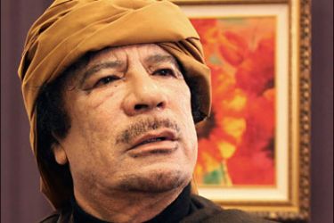 r_Libya's leader Muammar Gaddafi poses after an interview with TRT Turkish television reporter Mehmet Akif Ersoy at the Rixos hotel in Tripoli March 8, 2011.