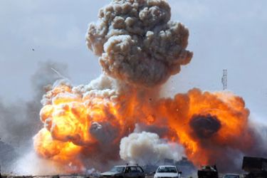 Vehicles belonging to forces loyal to Libyan leader Muammar Gaddafi explode after an air strike by coalition forces, along a road between Benghazi and Ajdabiyah March 20, 2011.