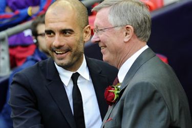 afp-Barcelona's Spanish coach Josep Guardiola (L) embraces Manchester United manager Alex Ferguson