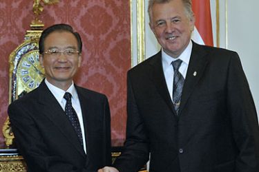 Chinese Prime Minister Wen Jiabao(L) poses with Hungarian President Pal Schmitt (R) in Maria Theresia Hall of the presidential palace at Buda Castle in Budapest on June 25, 2011 prior to their talks. Wen Jiabao is on the second day of his two-day official visit to Hungary. Wen Jiabao is the first Chinese premier who pays an official visit to Hungary after the Soviet-friend regime collapsed in 1990. AFP PHOTO / ATTILA KISBENEDEK