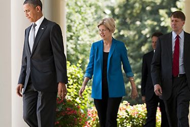 US President Barack Obama (L) arrives to nominate former Ohio Attorney General Richard Cordray (R) to lead a consumer protection bureau, a central feature of a law overhauling the rules that govern the financial sector during an event in the Rose Garden of the White House in Washington, DC, July 18, 2011. Also pictured is US Secretary of the Treasury Tim Geithner (2nd R) and Assistant to the President and Special A