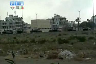 epa02865338 A grab from a handout video made available by Shaam News Network on its youtube channel on 13 August 2011, shows a Military armor vehicles alleged on the outskirts of Lattakia, Syria. According to media report, Syrian army troops on 13 August stormed the coastal city of Latakia in the latest crackdown on restive areas in the country.
