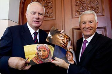Director if the Nobel Institute Geir Lundestad (L) and the leader of the Nobel Committee Thorbjoern Jagland show pictures of the 2011 Nobel Peace laureates (L-R) Yemeni activist Tawakkul Karman, Liberian president Ellen Johnson Sirleaf and Liberian peace activist, Leymah Gbowee in Oslo on October 7, 2011. AFP PHOTO/ Terje Bendiksby / Scanpix