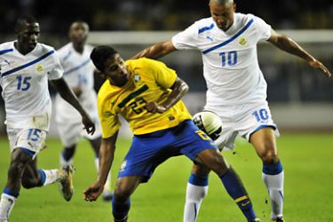 afp-Brazil's Alex Silva (C) fights for the ball with Gabon's Domarcolino Cousin (R) and Andre Biyogho Poko (L)