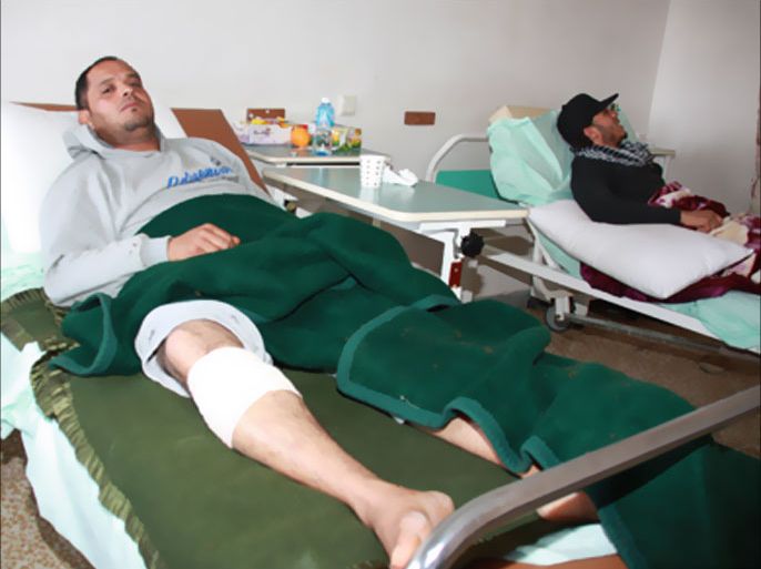 Injured militiamen from Gharyan are pictured at the town's central hospital, south of Tripoli, on January 16, 2012, as rival Libyan fighters who clashed in the adjacent towns of Assaba and Gharyan, some 80 kilometres (50 miles) from the capital, have settled their deadly dispute through a prisoner swap and agreed to a ceasefire, according to local officials.