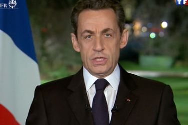 tv grab taken from French TV channel TF1 shows French President Nicolas Sarkozy addressing his New Year's wishes to the nation on December 31, 2011 at the Elysee presidential Palace in Paris. AFP PHOTO