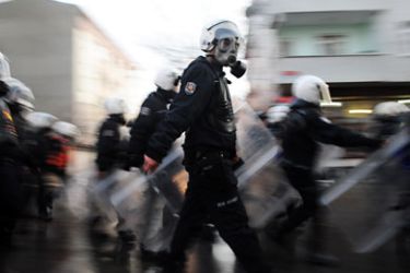 Turkish riot policemen search for protestors at Gazi district in Istanbul on January 1, 2012 during a demonsration against a Turkish air raid