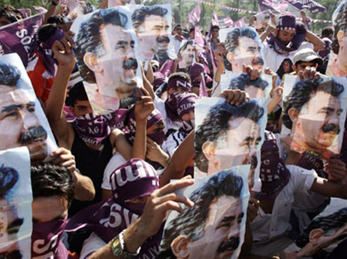 AFP/ Turkish Kurds hold posters of Abdullah Ocalan, the jailed leader of the outlawed Kurdistan Workers Party (PKK) during a pre-election rally of the Independent Candidates in Istanbul, 15 July 2007.