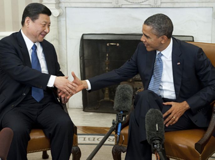 US President Barack Obama shakes hands with Chinese Vice President Xi Jinping during meetings in the Oval Office of the White House in Washington, DC, February 14, 2012.