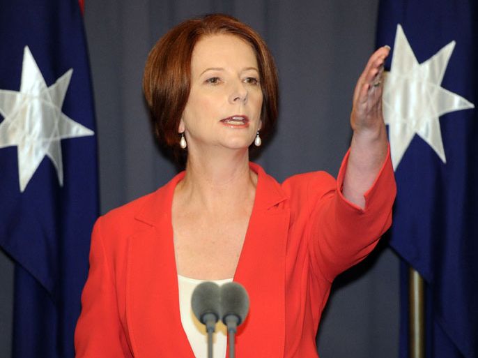 Australian Prime Minister Julia Gillard gestures during a press conference after emerging victorious from the Labor leadership challenge at Parliament House in Canberra on February 27, 2012