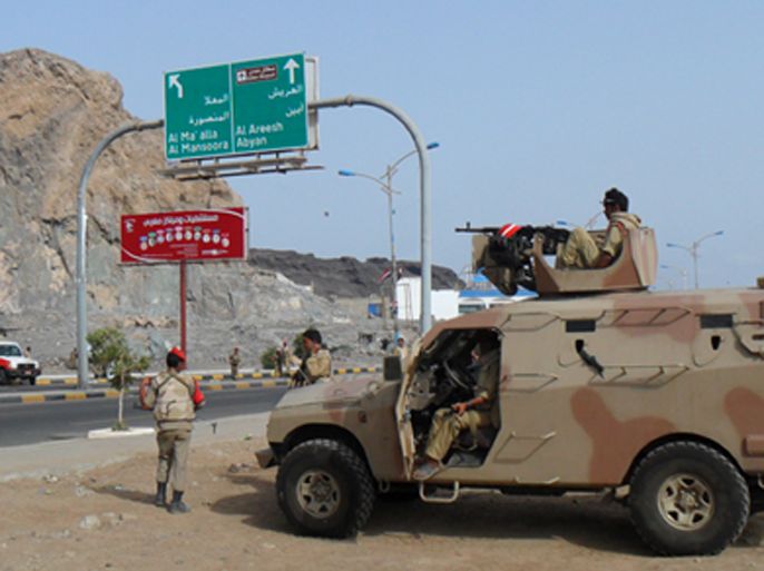 Yemeni soldiers secure a main road in the southern port city of Aden on February 21, 2012 as the country votes in the presidential election that brings an end to President Ali Abdullah Saleh's 33-year hardline rule in Yemen, the first Arab state where a revolt ended in a negotiated settlement.