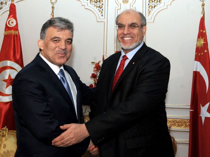 President of the Republic of Turkey Abdullah Gul (L) shakes hands with Tunisian Prime minister Hamadi Jebali at the Gammarth Palace in Tunis on March 8, 2012. Gul is on three day official visit to Tunisia. AFP PHOTO / FETHI BELAID