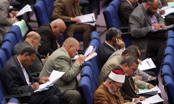 Members of Egypt's parliament attend a conference on March 24, 2012, to vote for a panel that will draft the first constitution since the uprising that toppled president Hosni Mubarak in February 2011. The liberals accused the majority Islamists of trying to monopolise the 100-member panel, whose constitution will replace the one annulled by the ruling military.