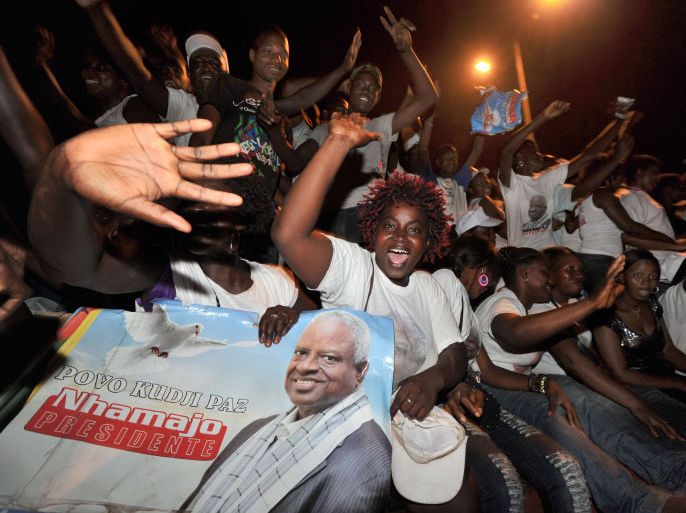 Guinea Bissau presidential candidate Manuel Serifo Nhamadjo's supporters cheer during a presidential campaign rally on March 16, 2012 in Bissau. Guinea-Bissau will elect a new president Sunday, a key test for the fragile, coup-prone state where a powerful army has resisted reforms, and cocaine cartels have deep roots. AFP PHOTO/ ISSOUF SANOGO