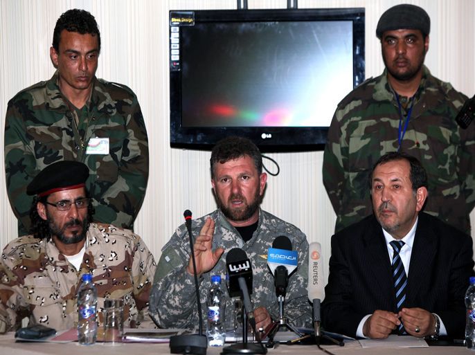commander of the Libyan Swehli militia of Misrata, Faraj Swehli (C), speaks during a press conference in Tripoli on March 4, 2011 where he said that the two British journalists, Nicholas Davies and Gareth Montgomery-Johnson, who work for Iran's Press TV, are being held for illegal entry and possible espionage. The Sweihli militia of Misrata, which also has operatives