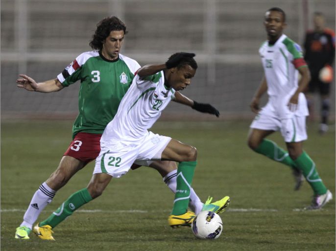 Oman’s Al-Uruba footballer Jumaa al-Maashari (2nd L) challenges Bilal Abdul Daim of Jordan's Al-Wehdat club during their AFC Cup football match in Amman on March 21 2012. AFP PHOTO/KHALIL MAZRAAWI