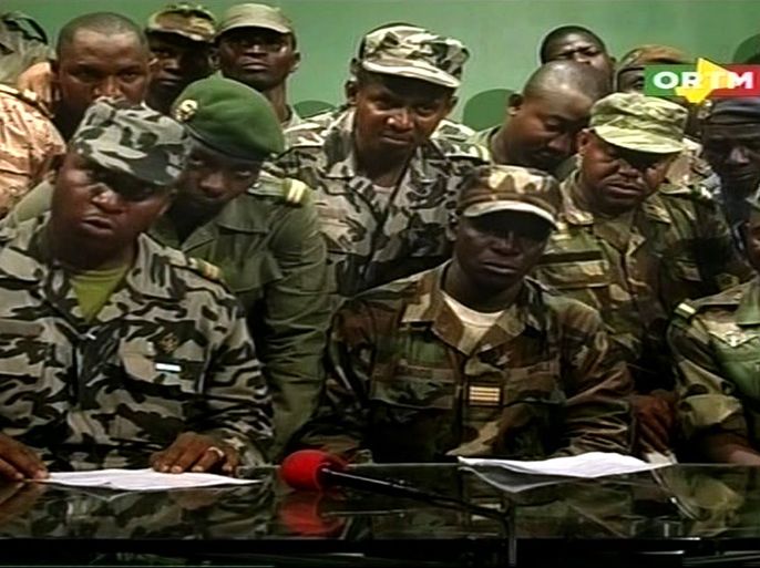 Screengrab taken on March 22, 2012 from ORTM shows group of soldiers announcing a curfew in Bamako starting from March 22 following a military coup. The putschists, calling themselves the National Committee for the Establishment of Democracy, said they had acted due to government's "inability" to put down a Tuareg-led insurrection in the north and tackle terrorism.