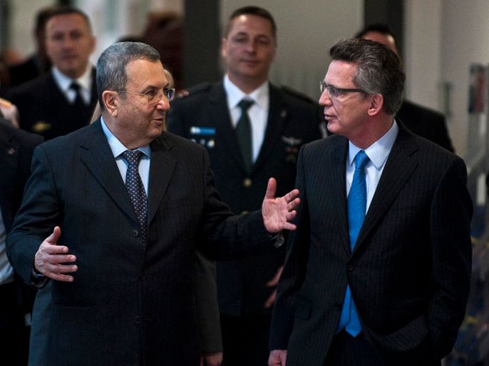 German Defence Minister Thomas de Maiziere (R) and his Israeli counterpart Ehud Barak arrive for a press conference at the ministry of defence in Berlin on March 20, 2012. Barak is in Berlin for talks on the Middle East and bilateral ties. AFP PHOTO / JOHN MACDOUGALL