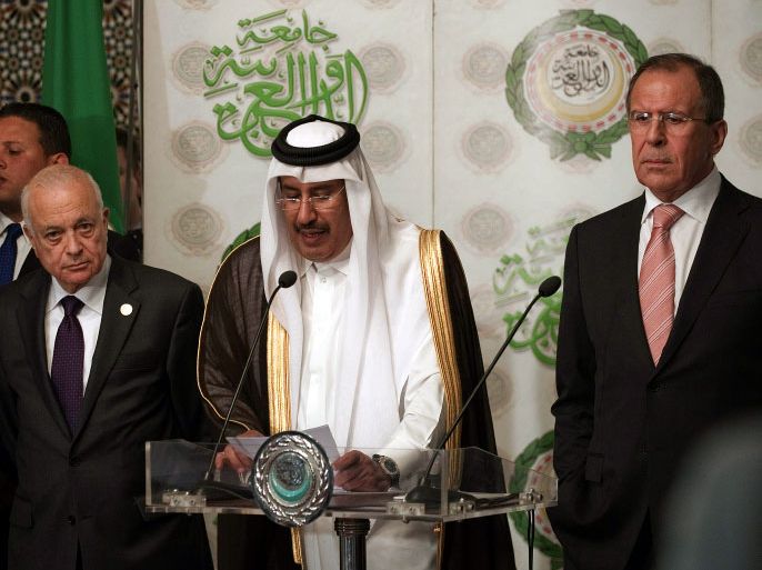 Qatari Prime Minister and Head of the Arab League committee on Syria, Sheikh Hamad bin Jassem al-Thani (C) speaks during a press conference with Russian Foreign Minister Sergei Lavrov (R) and Arab League Secretary General Nabil al-Arabi (L) after meeting on March 10, 2012, to discuss Syria at the Arab League headquarters in Cairo. During the meeting Lavrov made clear to the UN-Arab League envoy for Syria Kofi Annan that Moscow opposed "crude interference" from outside in Syrian internal affairs. AFP PHOTO/GIANLUIGI GUERCIA