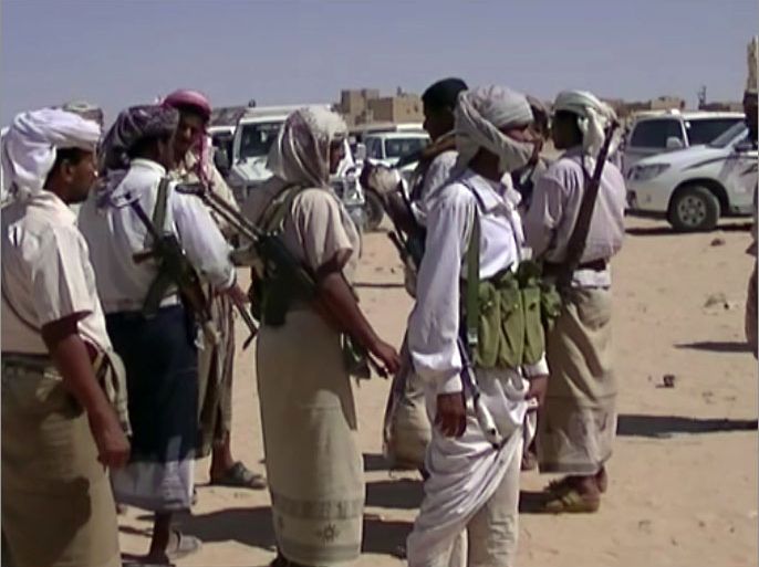 A picture taken on April 10, 2012 with a mobile phone shows a Yemeni tribal gunmen helping the government forces in their battle against the Al-Qaeda network gathering in the southern town of Loder in Yemen's Abyan province where at least 124 people were killed in 48 hours of clashes sparked when militants linked to Al-Qaeda raided an army barracks there on April 9. Yemeni soldiers backed by tribesmen fought over the past two days the extremists who vowed to retake a strategic town. AFP PHOTO/STR