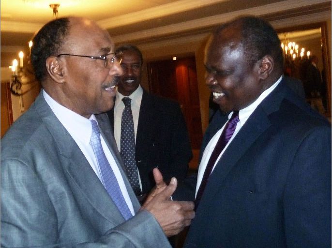Sudan’s Minister of Defence, Abdel -Rahim Mohamed Hussein (L), greets Pagan Amum, chief negotiator for South Sudan ahead of security (R) talks in Addis Ababa on April 2, 2012. Talks were scheduled to take place on March 31, 2012 but were stalled when Juba accused the North of “waging war” following seven days of violence in Unity State, which the North denied. Delegations from the North and South finally met to discuss the ongoing crisis. South Sudan split from the North in July following two decades of civil war, but tension have remained high between two nations which have failed to agree on outstanding border and oil disputes. AFP PHOTO/JENNY VAUGHAN.
