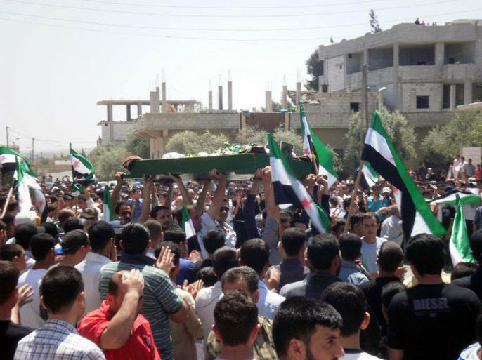 A handout picture released by the Syrian opposition's Shaam News Network shows Syrians carry the coffin of a violence victim, Nawras al-Azzawi in his funeral in Daraa on April 27, 2012. Amnesty International said that it has received the names of more than 360 people reportedly killed in Syria since UN ceasefire