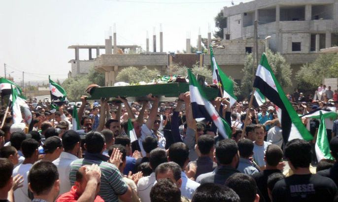 A handout picture released by the Syrian opposition's Shaam News Network shows Syrians carry the coffin of a violence victim, Nawras al-Azzawi in his funeral in Daraa on April 27, 2012. Amnesty International said that it has received the names of more than 360 people reportedly killed in Syria since UN ceasefire