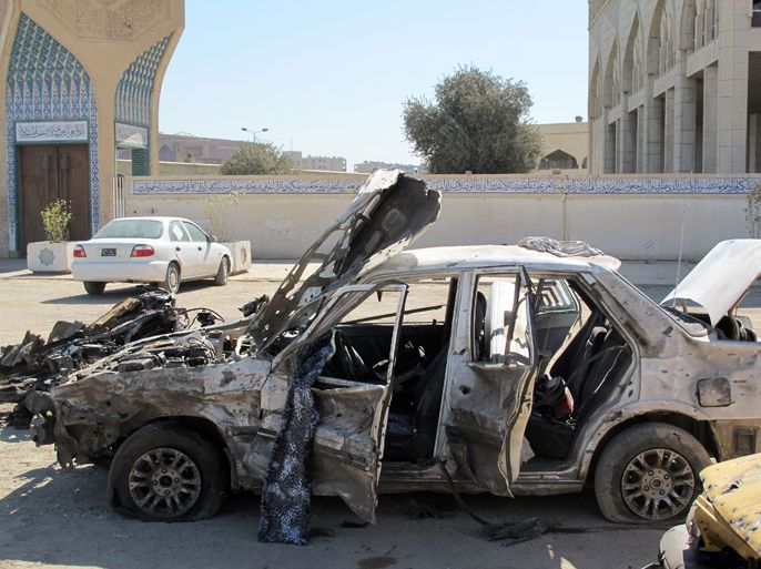 oyed vehicles are seen at the site of a car bomb that was set off by a suicide attacker in the centre of Baghdad, killing four people and wounded eight, on March 20, 2012.