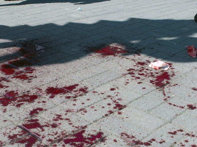 Blood spots cover pavement a the site of one of the blasts in the eastern Ukrainian city of Dnipropetrovsk, on April 27, 2012. At least 27 people were injured today in Dnipropetrovsk in four successive blasts that President Viktor Yanukovych called a challenge to the nation. AFP
