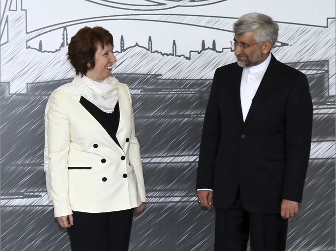 Iran's top national security official Saeed Jalili (R) poses with European Union's Foreign Policy chief Catherine Ashton before a meeting on April 14, 2012 as Iran and six world powers open talks on Tehran's disputed nuclear programme in Istanbul. AFP PHOTO/ POOL/ TOLGA ADANALI