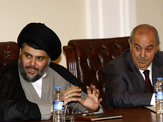 Iraqi Shiite cleric Moqtada al-Sadr (L) and former premier Iyad Allawi (R) attend a meeting of Iraqi leaders in Arbil, the capital of Kurdistan in northern Iraq, on April 28, 2012. Top Iraqi politicians, many of whom feel marginalised by Prime Minister Nuri al-Maliki's style of governing, called on Saturday in Arbil for greater democracy in running the country. AFP