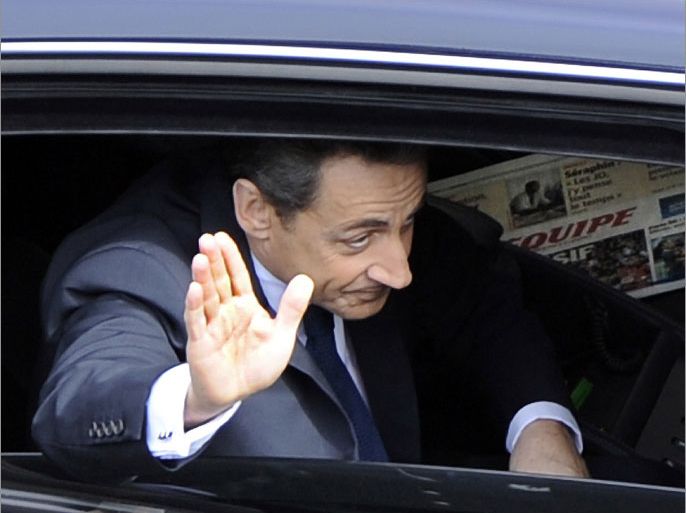 France's outgoing president Nicolas Sarkozy gestures as he leaves a ceremony marking the 67th anniversary of the Allied victory over Nazi Germany in World War II, in Paris, on May 8, 2012 at the Arc de Triomphe in Paris. AFP PHOTO BERTRAND GUAY