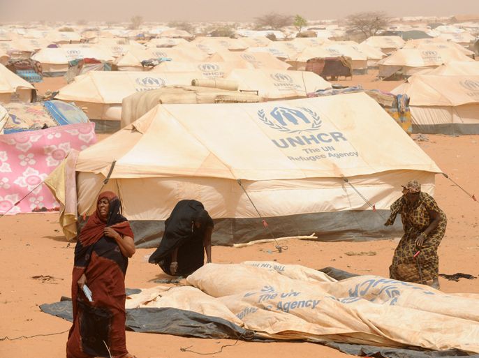 Malian refugees set up a tent in the M'bere refugee camp near Bassiknou in the Nema region of Southwestern Mauritania on May 2, 2012. More than 320,000 people have fled their homes in Mali since mid-January, with more than half seeking refuge in neighbouring countries, UN officials said. AFP