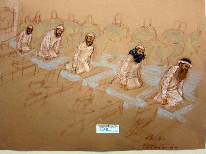 Guantanamo Bay, -, CUBA : In this courtroom drawing reviewed and approved for release by a US military security official, (L-R) Mustafa al Hawsawi, Ammar al Baluchi, Ramzi bin al Shibh, Walid Bin Attash, also spelled Waleed bin Attash and Khalik Sheikh Mohammad, pray at their arraignment May 5, 2012. The suicide attacks by Al-Qaeda militants in hijacked airliners killed 2,976 people in New York, Washington and Shanksville, Pennsylvania. AFP PHOTO/POOL/JANET HAMLIN