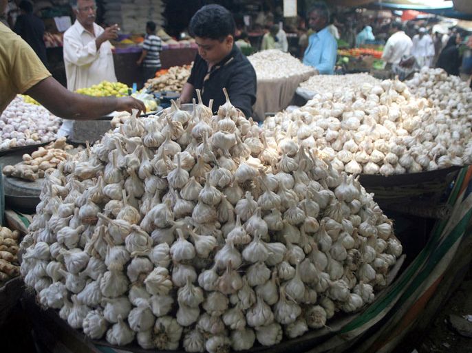 A vendor sells garlic at a grocery shop ahead of holy Fasting month of Ramadan, Karachi, Pakistan, 26 July 2011. Muslims all over the world are preparing for Ramadan, which according to Lunar calender would start from 01 or 02 of August. Ramadan prohibits eating, drinking, smoking and having sex from dawn to dusk. EPA/REHAN KHAN