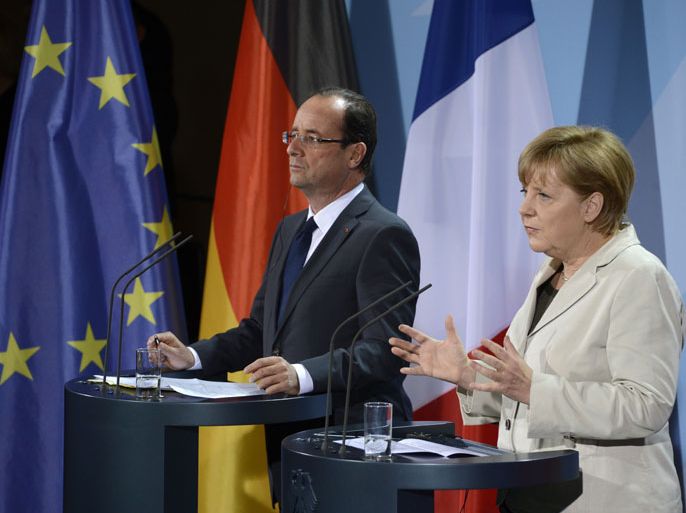 DG004 - Berlin, Berlin, GERMANY : German Chancellor Angela Merkel (R) and the new French president Francois Hollande address a press conference at the German Chancellery on May 15, 2012 in Berlin. Francois Hollande meets Angela Merkel for their first talks on the debt crisis as Greece's future in the eurozone appears uncertain before giving a news conference and sharing a working dinner